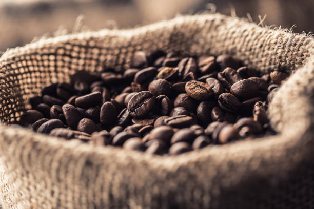 istock Close-up fresh roasted coffee beans in bag. 1034317878