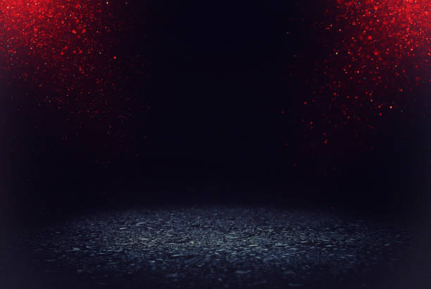 istock dark concentrate or asphalt floor with dark red and black glitter background. 1034318030