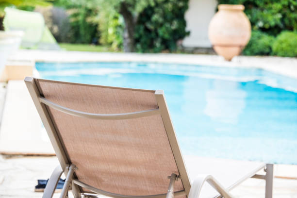 istock Pool with sun lounger 1034319570