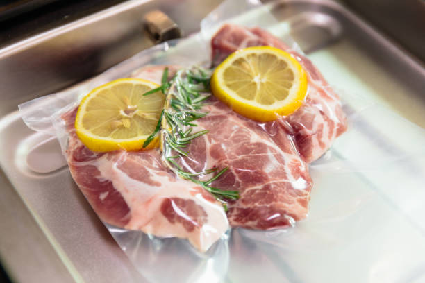 istock Sous vide steak with rosemary and lemons in vacuumed package. 1034322408