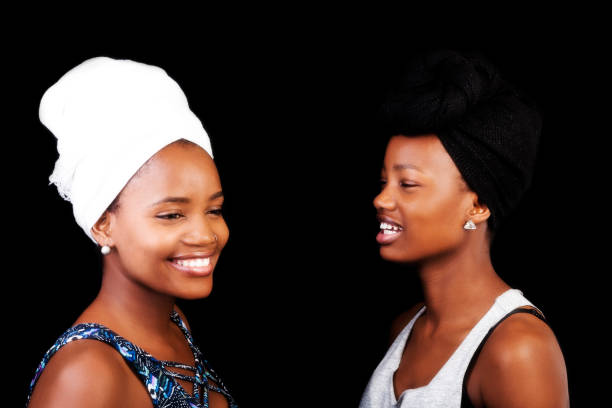 istock Two Smiling African American Sisters In Head Scarfs 1034326494