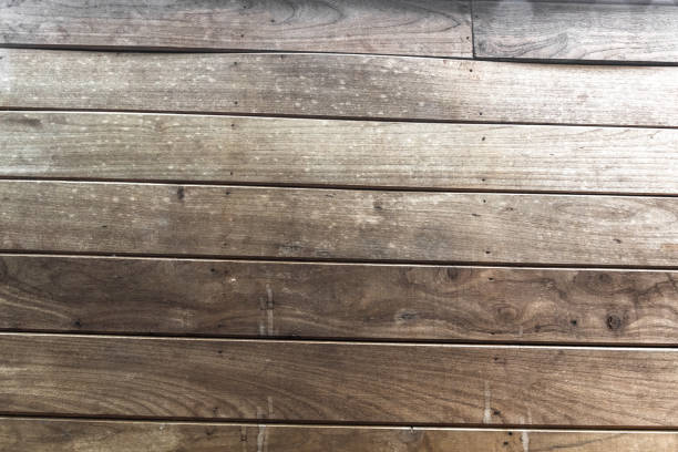 istock Wood table floor with natural pattern texture. Empty template  wood board can be used as background. 1034326530