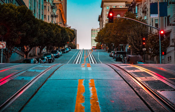 Famous California Street at dawn, San Francisco, California, USA Low angle twilight view of an empty road with cable car tracks leading up a steep hill at famous California Street at dawn, San Francisco, California, USA steep photos stock pictures, royalty-free photos & images