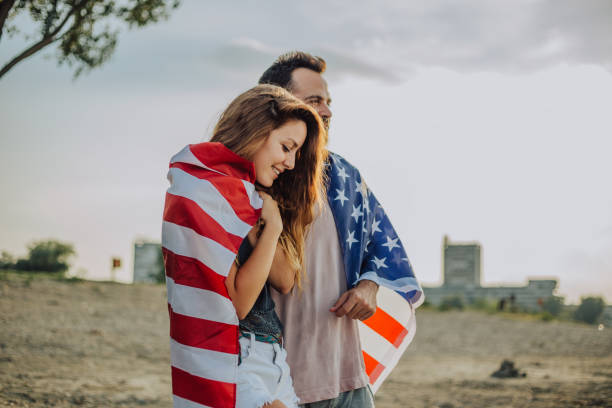 istock Young couple with American flag 1034329264