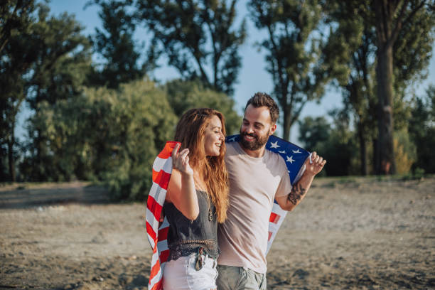 istock Happy couple under stars and stripes flag 1034329412