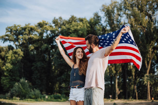 istock Happy couple under stars and stripes flag 1034329846