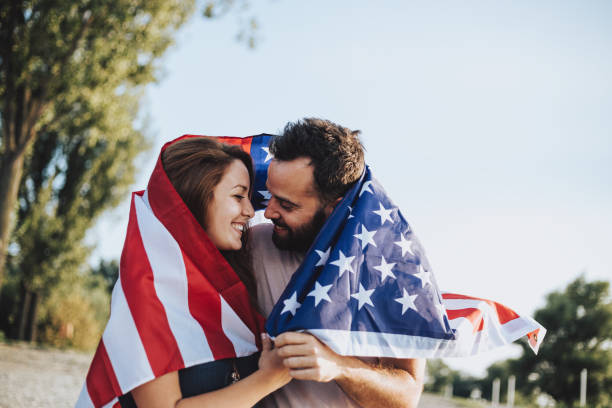 istock Happy couple under stars and stripes flag 1034330048