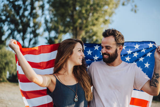 istock Happy couple under stars and stripes flag 1034330186
