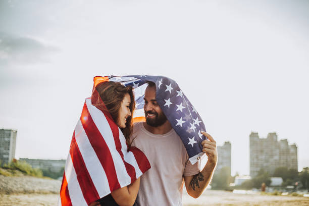istock Happy couple under stars and stripes flag 1034330494