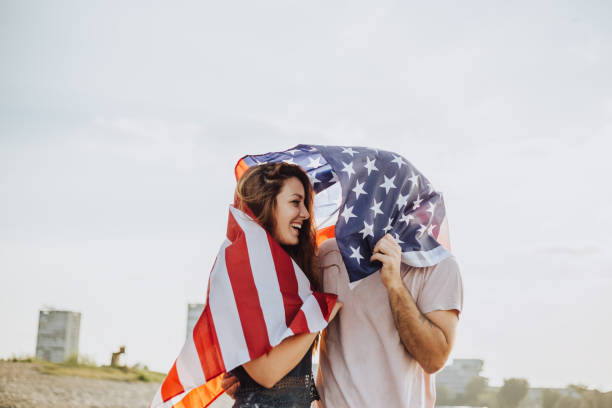 istock Happy couple under stars and stripes flag 1034330654