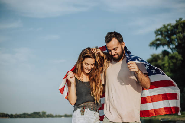 istock Happy couple under stars and stripes flag 1034330956