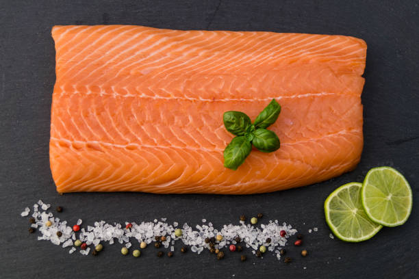 Salmon - Salmo Salar Fresh Atlantic salmon with sea salt, pepper and spices sockeye salmon filet stock pictures, royalty-free photos & images