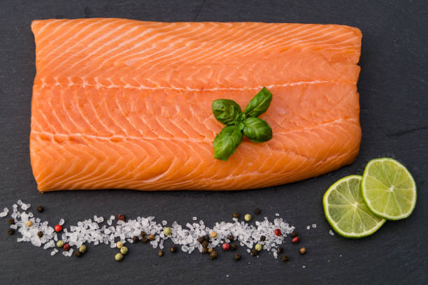 Salmon - Salmo Salar Fresh Atlantic salmon with sea salt, pepper and spices sockeye salmon filet stock pictures, royalty-free photos & images