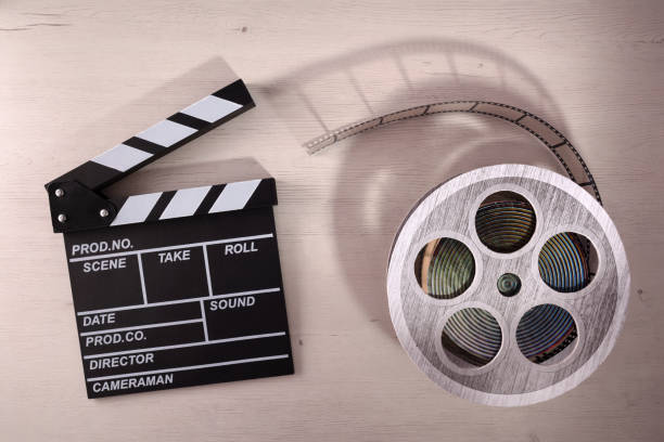 istock Clapper open and reel on wooden table 1034333408