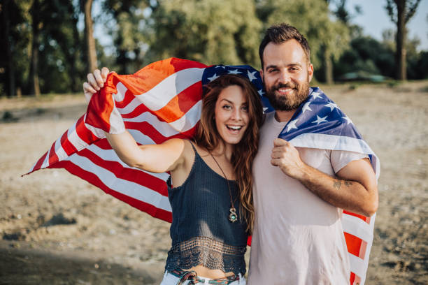 istock Happy couple under stars and stripes flag 1034333496