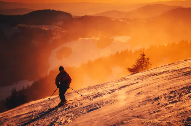 Winter sport photo. Ski in sunset light