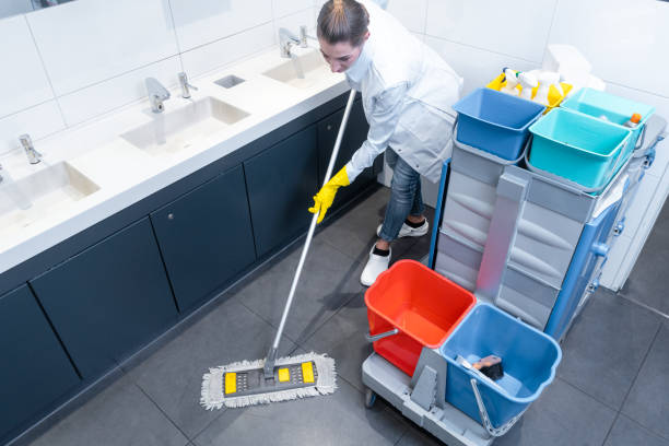 istock Cleaning lady mopping the floor in restroom 1034337596