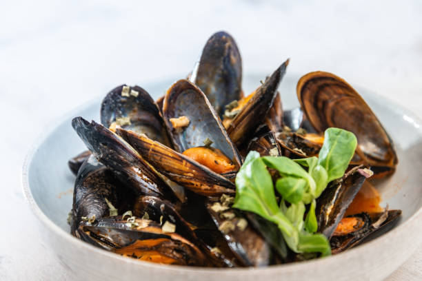 istock Mussel with white wine sauce on table 1034338238