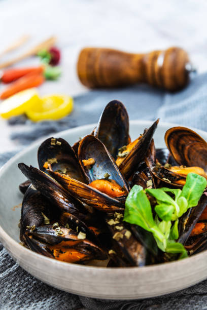 istock Mussel with white wine sauce on table 1034338244