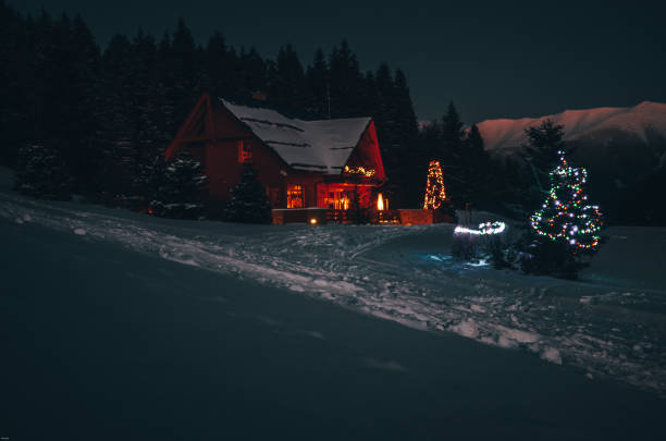 istock Christmas cottage in beautiful dark winter night 1034341250