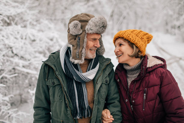 istock Senior couple enjoying a winter walk 1034341380