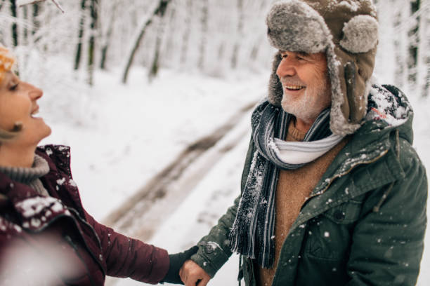 istock Senior couple enjoying a winter walk 1034341390