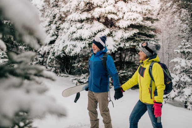 istock Senior couple walking in a ski resort 1034341438