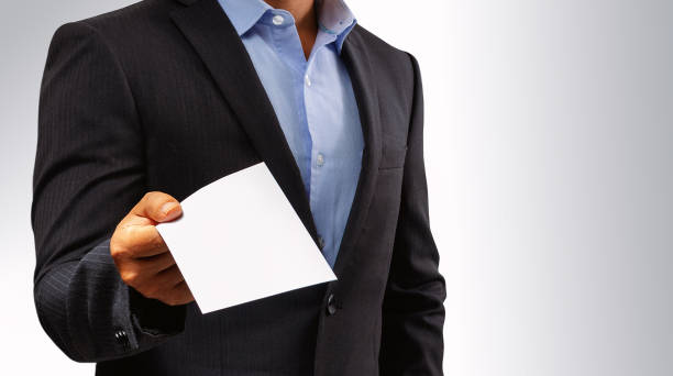 istock Management submits an envelope to employees. 1034347058