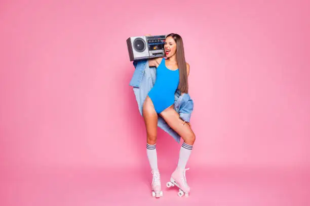 Photo of Let's make noise! Swag people person leisure hobby melody meloman concept. Full length body size photo of beautiful excited mad joyful girl holding tape radio on shoulder isolated pastel background