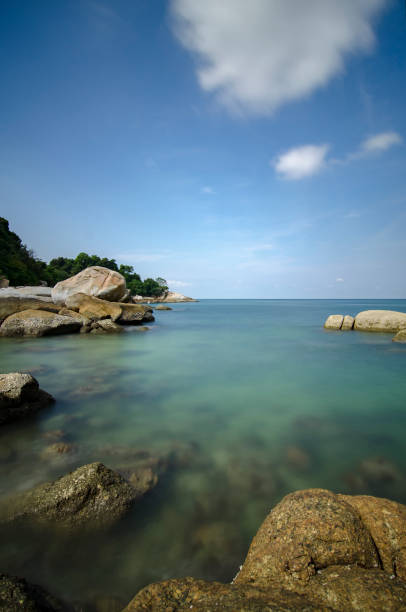 istock Beautiful tropical beach at sunny day with blue sky background 1034348726