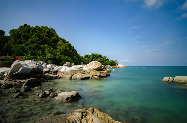 istock Beautiful tropical beach at sunny day with blue sky background 1034348844