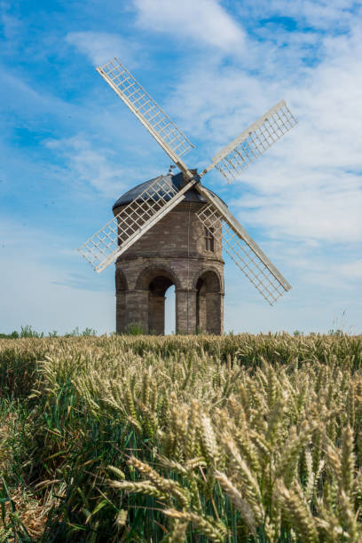 Old Windmill in Wheat Field, UK Old wood and stone windmill in Warwickshire, UK chesterton photos stock pictures, royalty-free photos & images