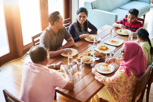 istock Multi-generation family having food at home 1034356576
