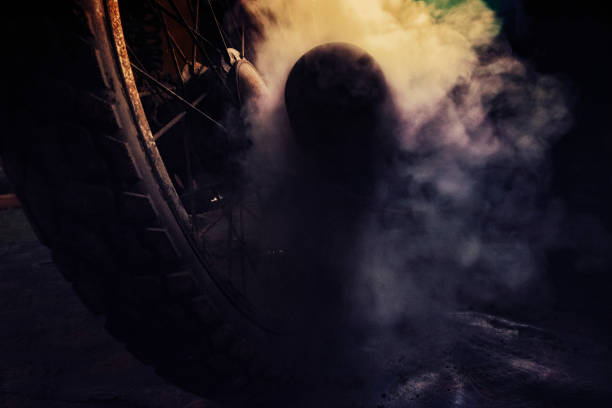 closeup abstract background, rusty old motorcycle under low light with noise, grain and smoke effect