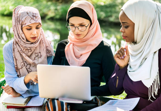 istock Group of islamic friends discussing and working together 1034357708