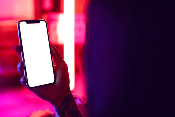 istock Young Woman Holding Blank Smartphone 1034362428
