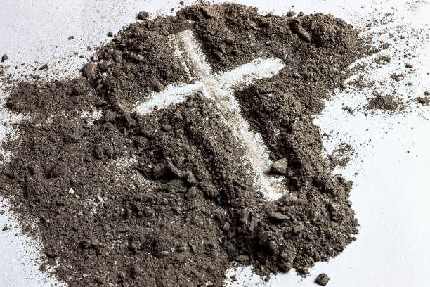 Cross shape made of ashes stock photo