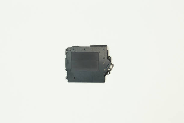 istock The camera shutter equipment on white paper for background. 1034363560