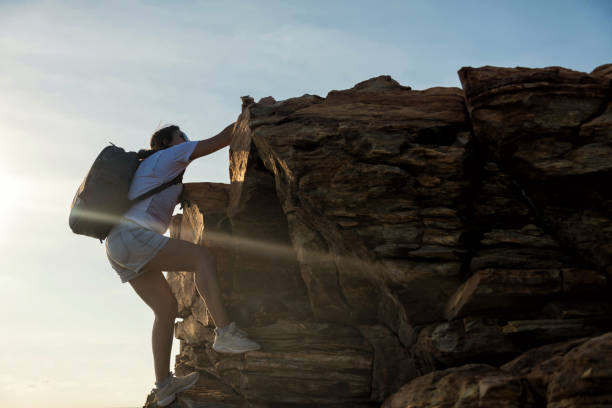 istock hiking woman climb to hill submit 1034364246