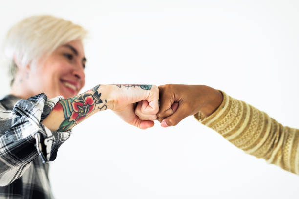 istock People bumping their fists together 1034365886