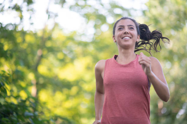 istock Happy Woman Jogging 1034369384