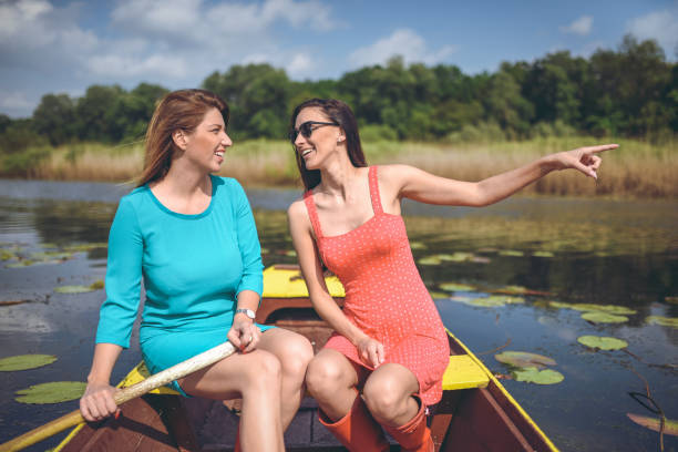 istock two beautiful girls  in a boat 1034369852