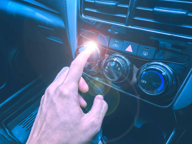 istock new technology and transportation concept from interior and display control in car with human hand control audio and air flow button 1034372408