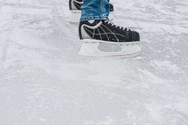 istock Man legs in ice skates closeup 1034372860