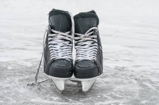 istock Skates closeup on skating rink 1034373054
