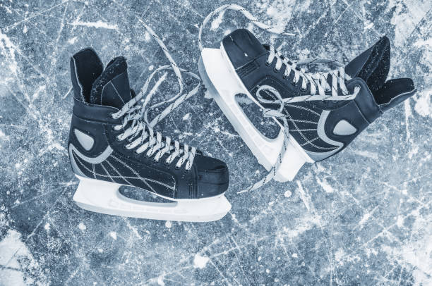 istock Skates closeup on the ice backgound 1034373158