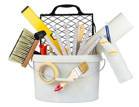 paint bucket filled with renovation decoration diy tools isolated on white background
