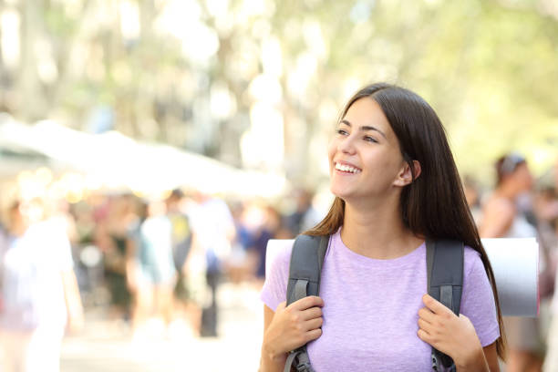 Backpacker looking at side in the street
