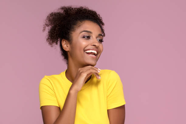 istock Excited smiling afro girl posing on pink. 1034375946