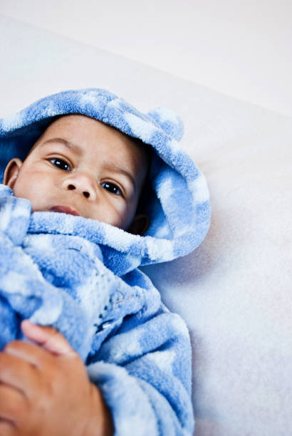 istock Toddler Posing In Blue Shower Robe 1034375968